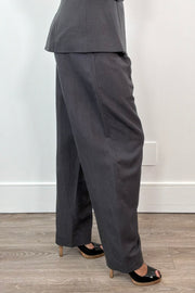 Side view of Woman wearing wide leg grey dress pants
