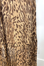 zoom in view of ruffles of a leopard printed maxi skirt
