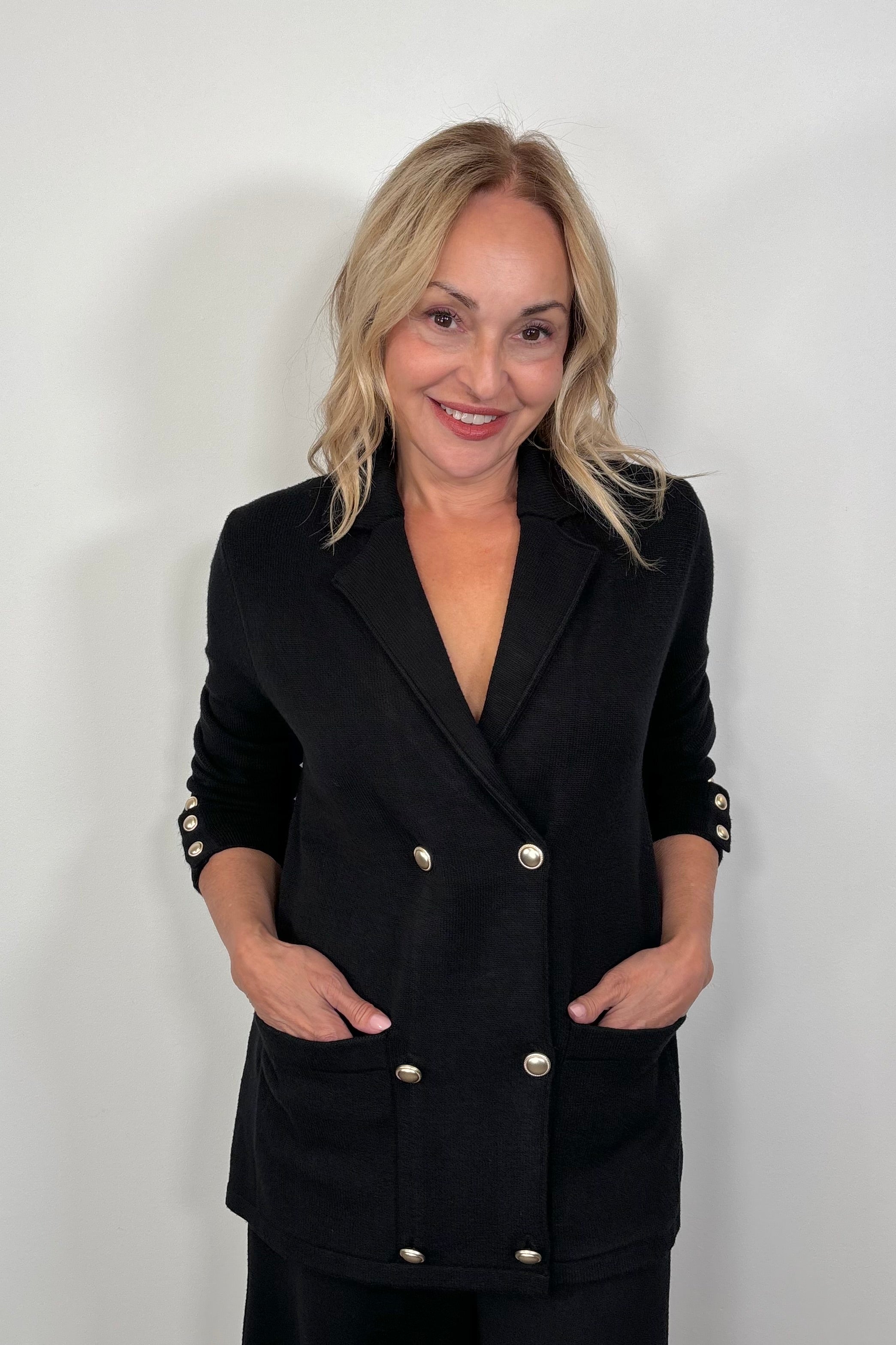 woman wearing a black sweater blazer