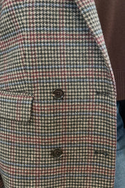 Woman wearing a checkered blazer