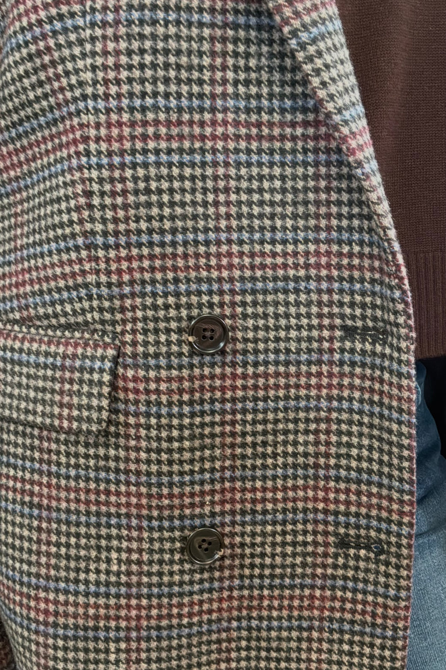 Woman wearing a checkered blazer