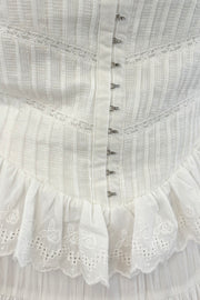 close up of Woman wearing a white dress