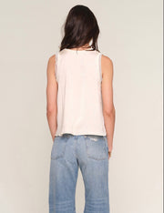 Back view of Woman wearing a cream tank top 