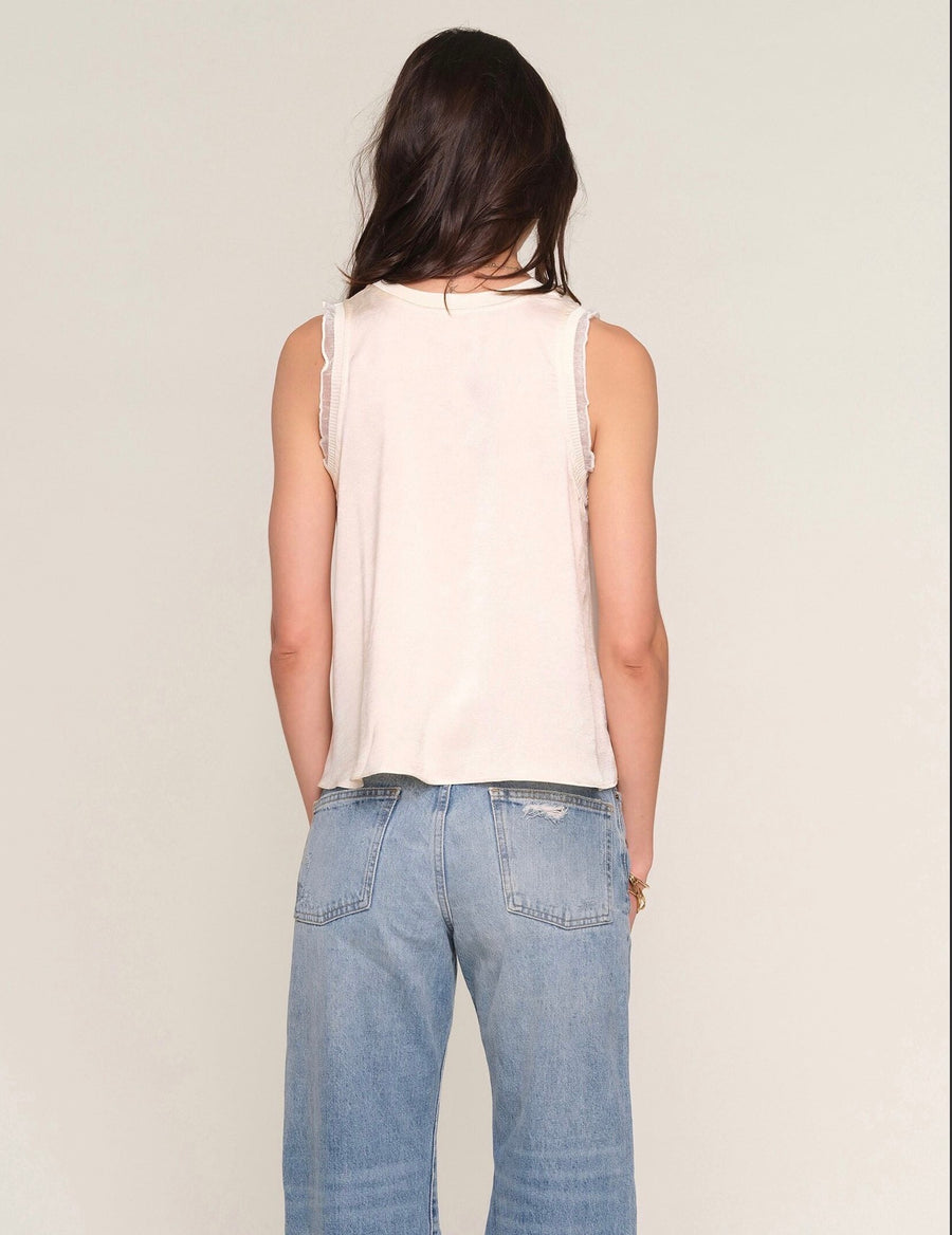 Back view of Woman wearing a cream tank top 