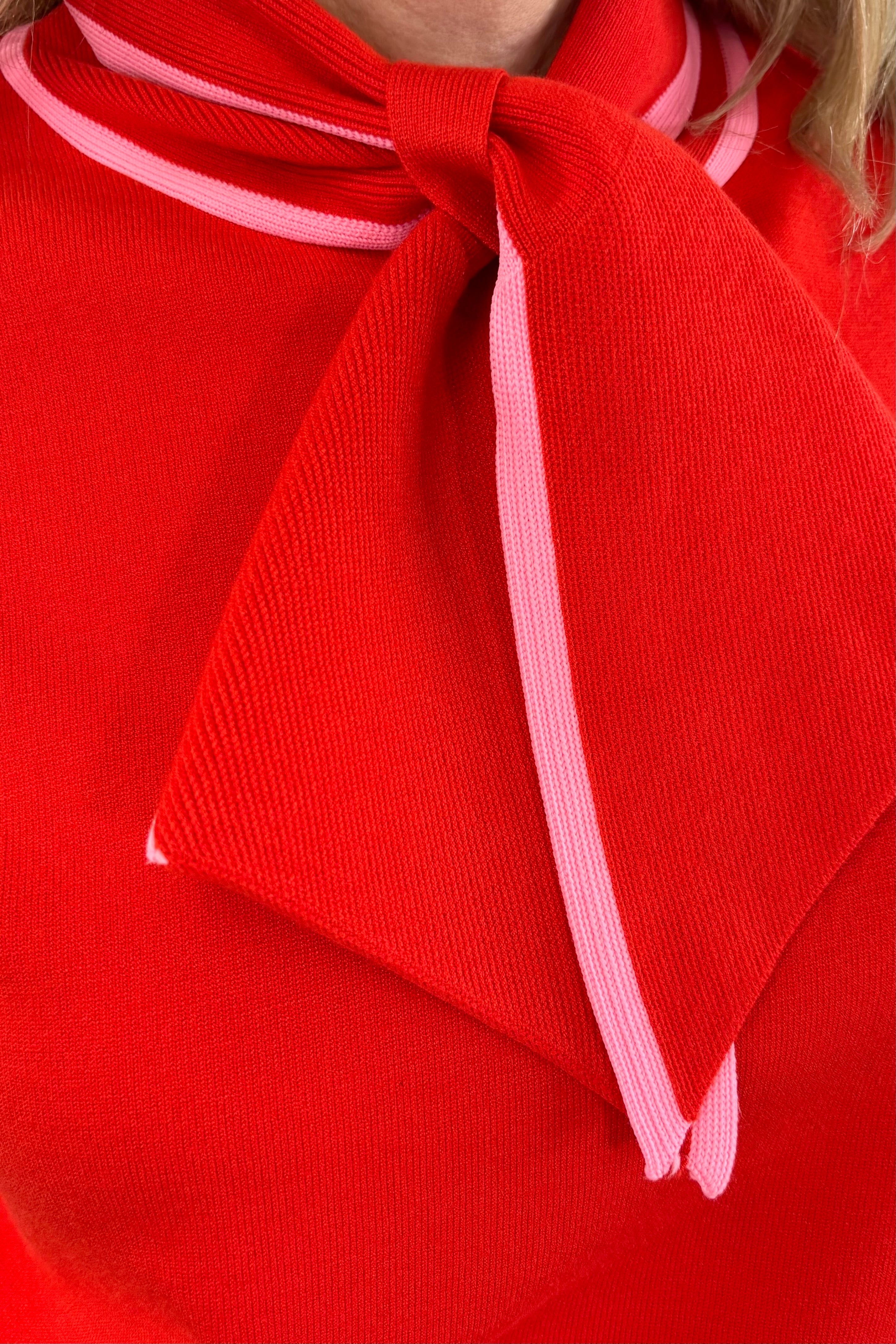 Close up of Woman wearing a bright red neck tie top