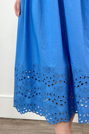 Close up of woman wearing a midi dress in light blue