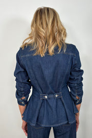 back view of woman wearing a fitted denim jacket