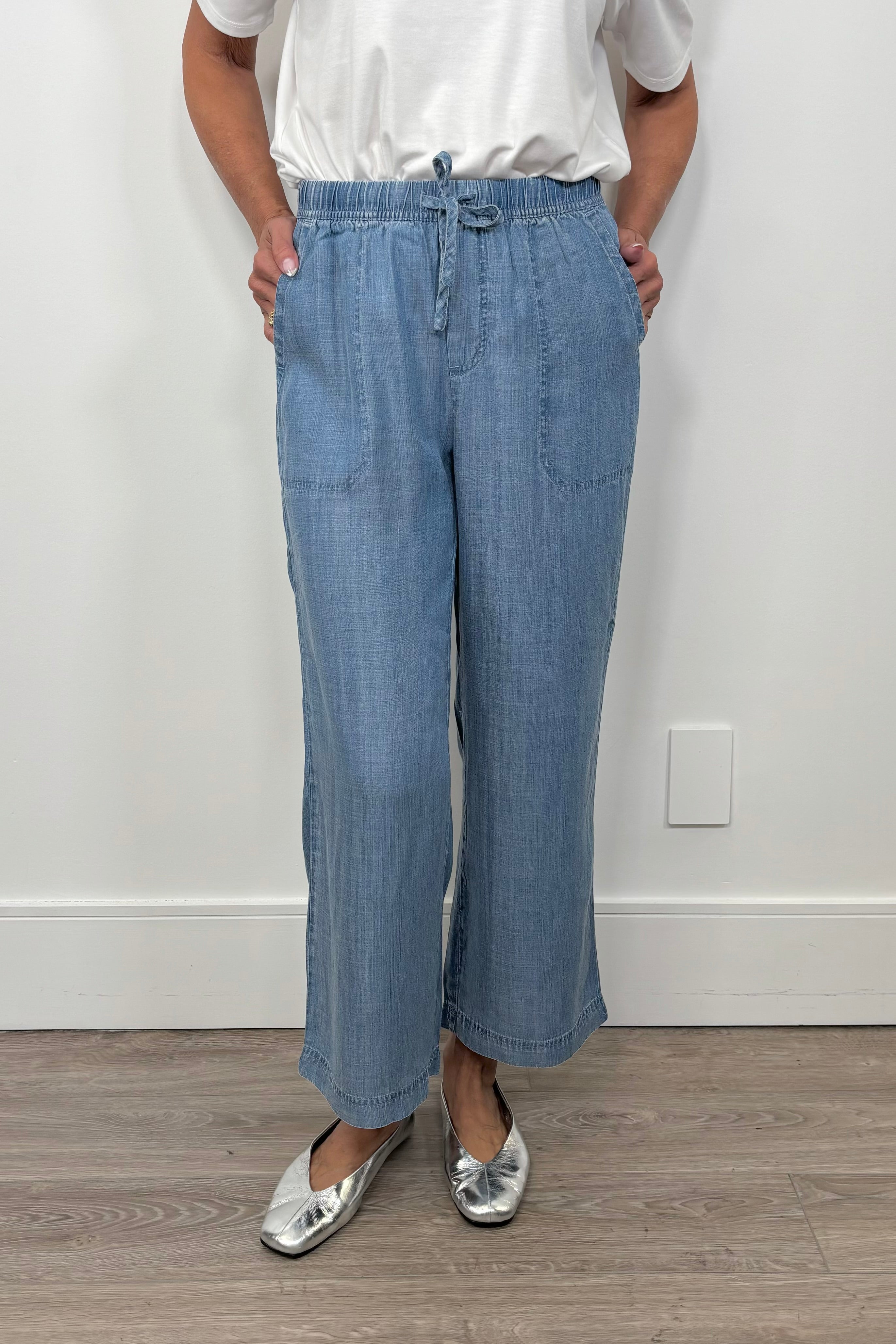 Front view of breathable blue pants with an elastic waistband 