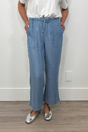 Front view of breathable blue pants with an elastic waistband 