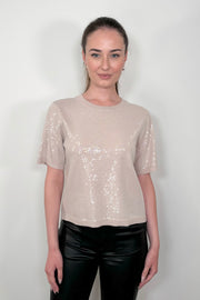 woman wearing a sequins short sleeve tee