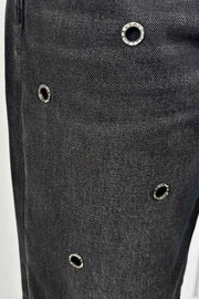 close-up of baggy jeans with metalware detailing