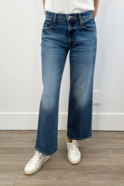 woman wearing wide leg mid rise washed blue denim
