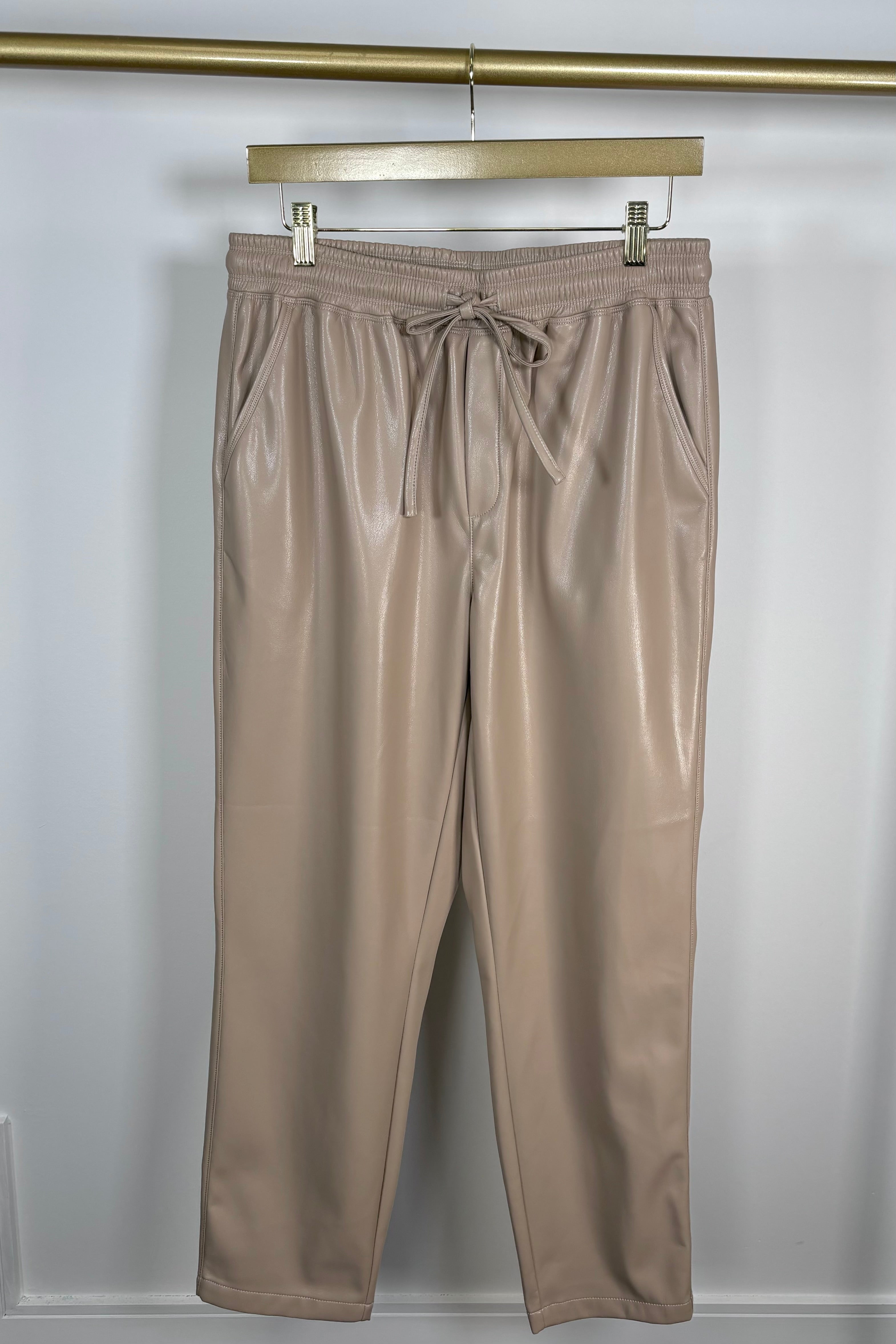 Front view of tan leather drawstring pants