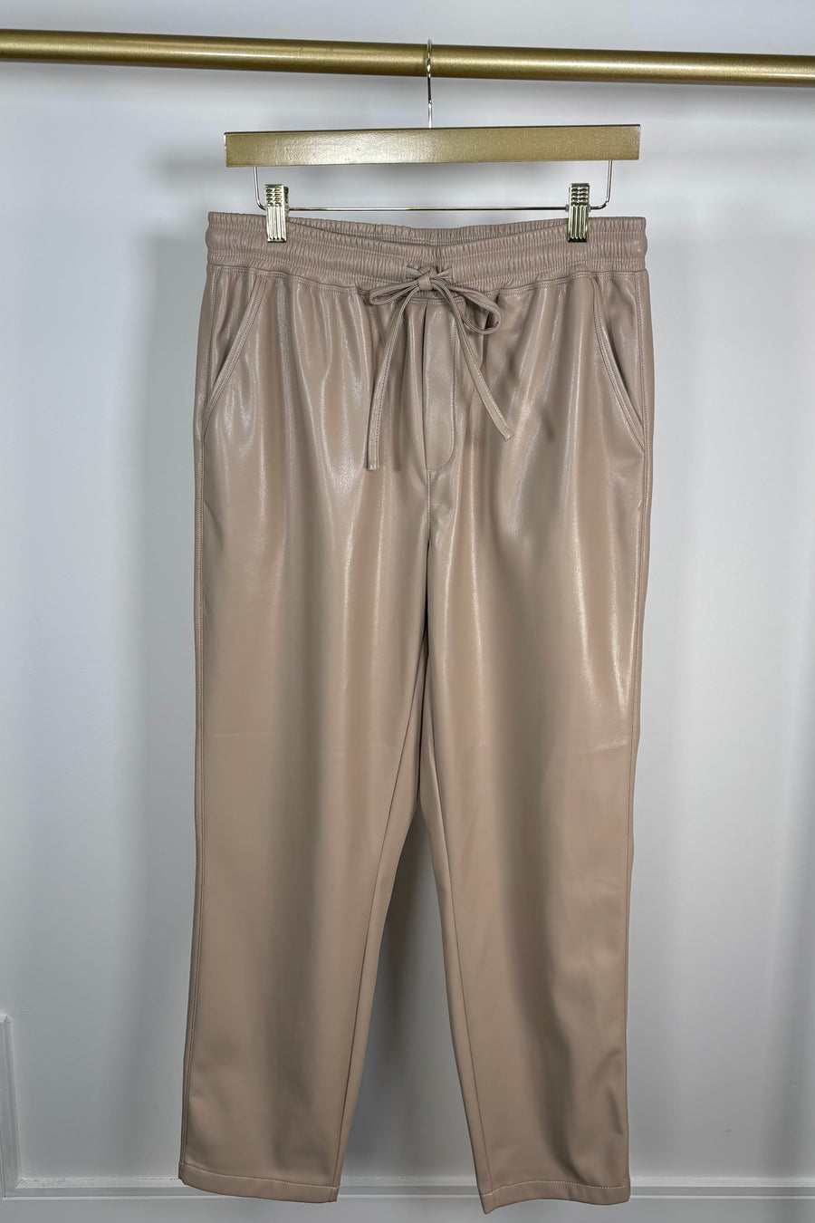 Front view of tan leather drawstring pants