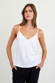 Woman weaning a white tank top