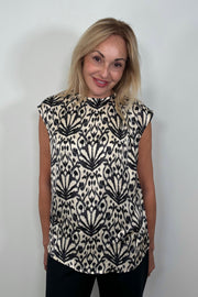 Front view of woman wearing a printed Satin sleeveless top
