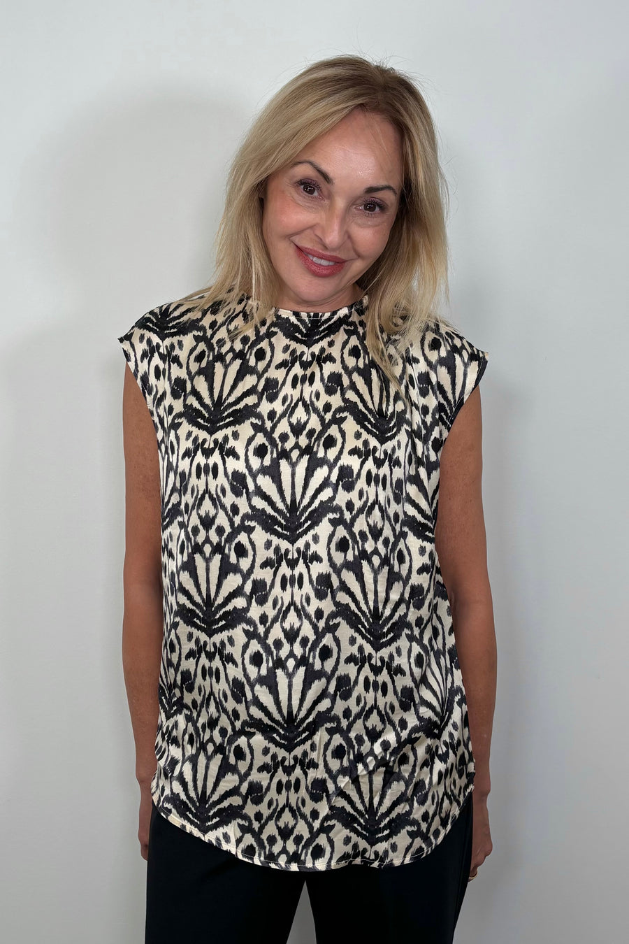 Front view of woman wearing a printed Satin sleeveless top