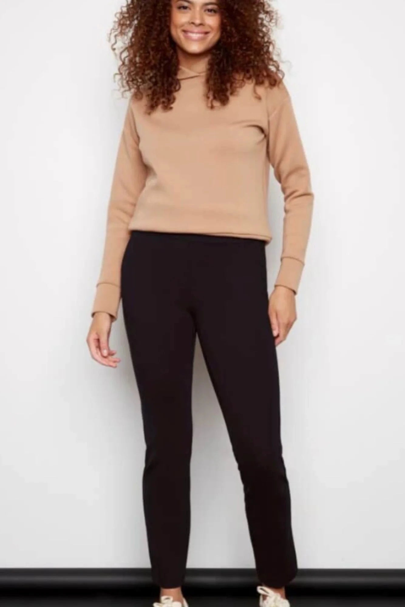 woman wearing black high waisted fitted pants 