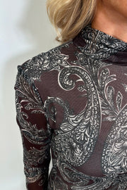 Close-up of the mock neck of a long sleeve mesh dress