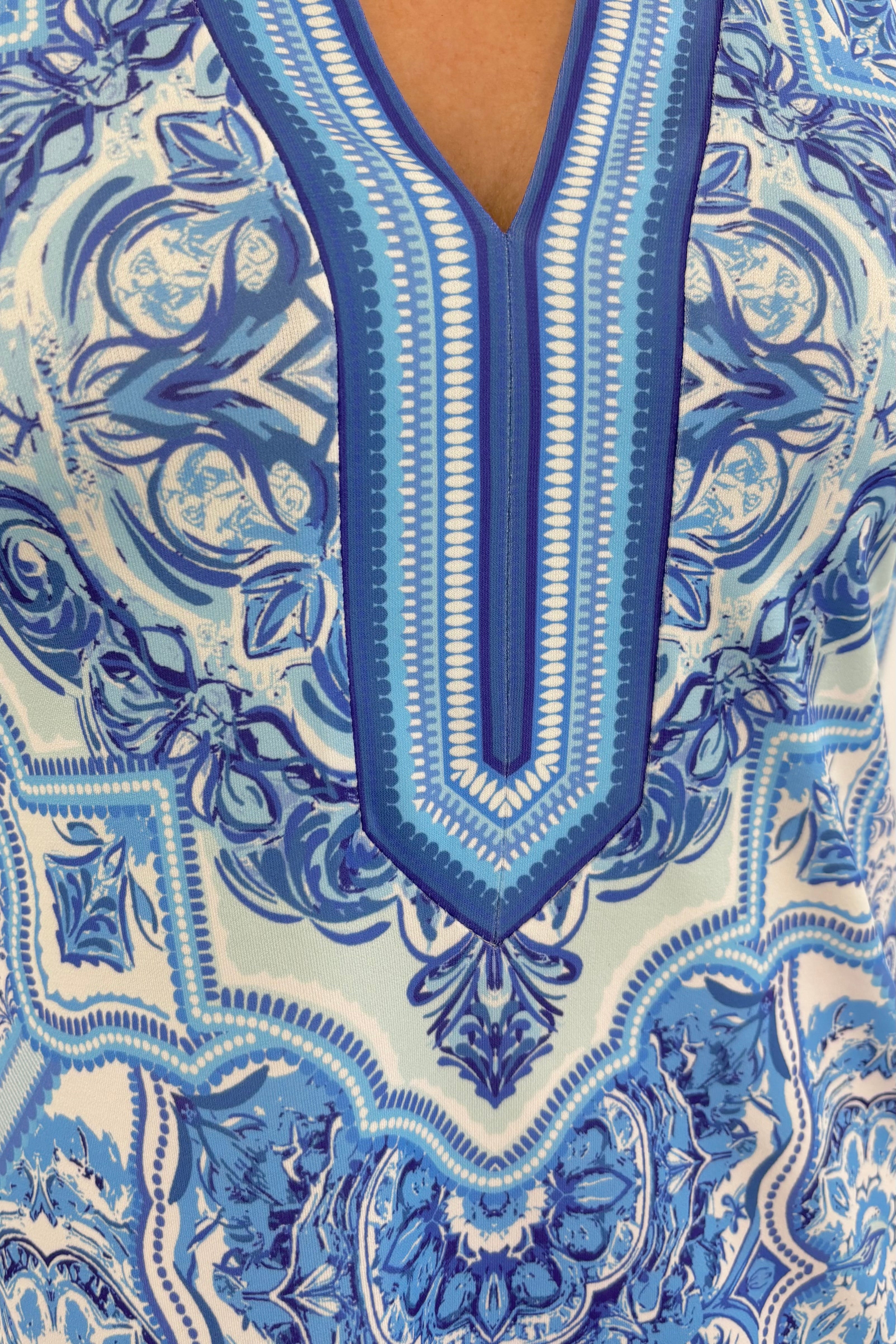 Close up of Woman wearing a blue patterned dress 