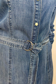 Close-up of a  button up denim dress with a belt 