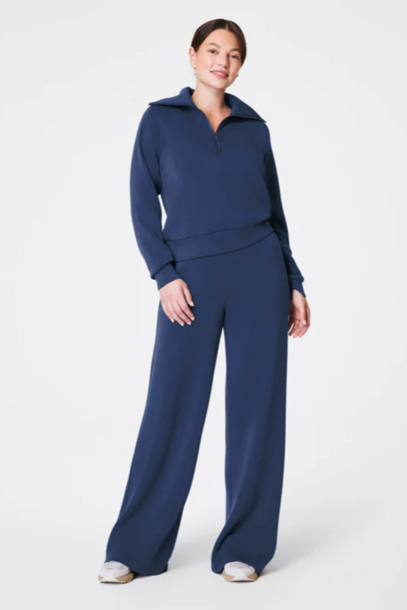 Woman wearing a blue outfit on a white background