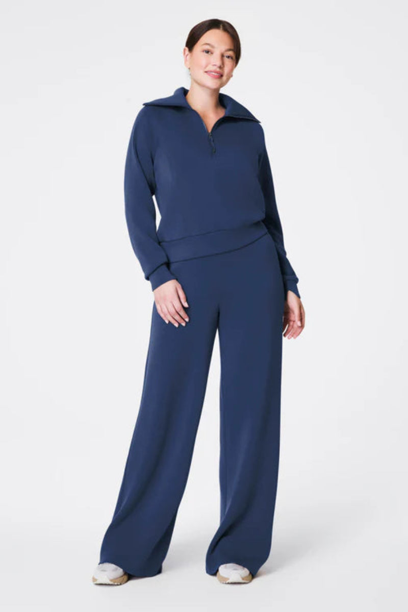 Woman wearing a blue outfit on a white background