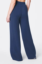 Navy blue wide-leg pants on a white background