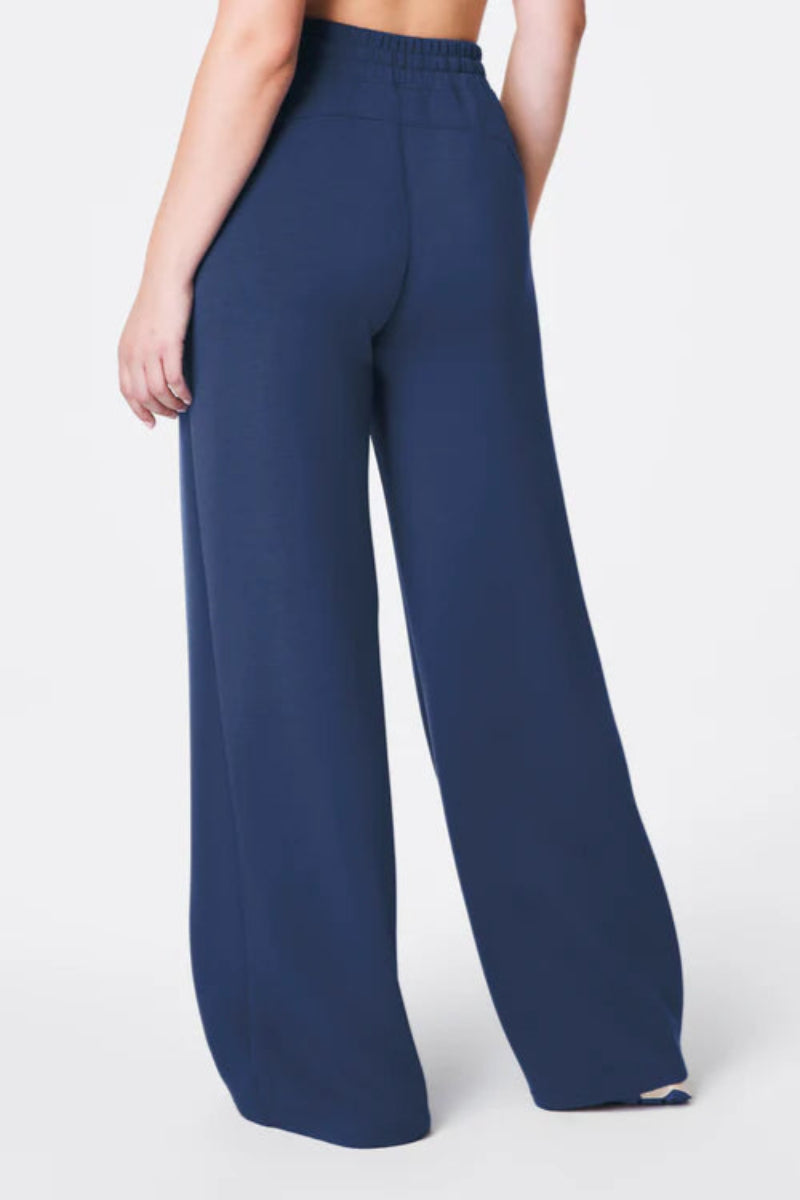 Navy blue wide-leg pants on a white background