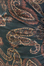 Close-up of a dark fabric with intricate paisley pattern