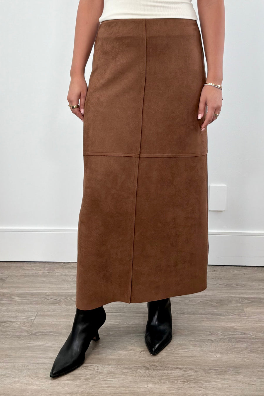 Women wearing a brown suede skirt