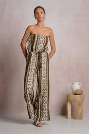 Woman wearing a strapless patterned jumpsuit 