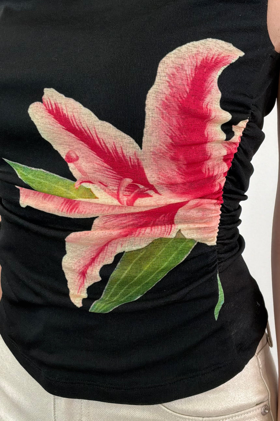 Closeup of Woman wearing a velvet top with flower graphic
