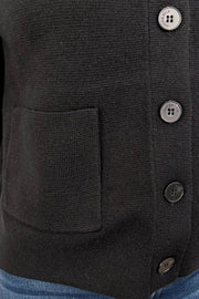 close up of black cardigan with pockets in the front