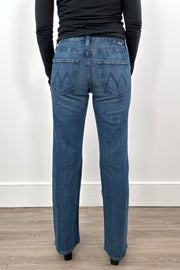 woman wearing straight leg boot cut blue jeans