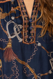 Close-up of a navy silk blouse with intricate pattern