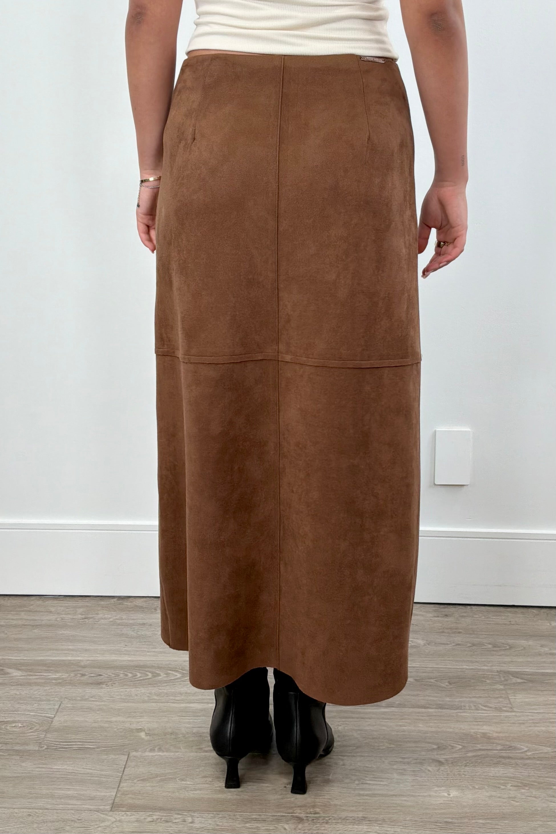 Women wearing a brown suede skirt