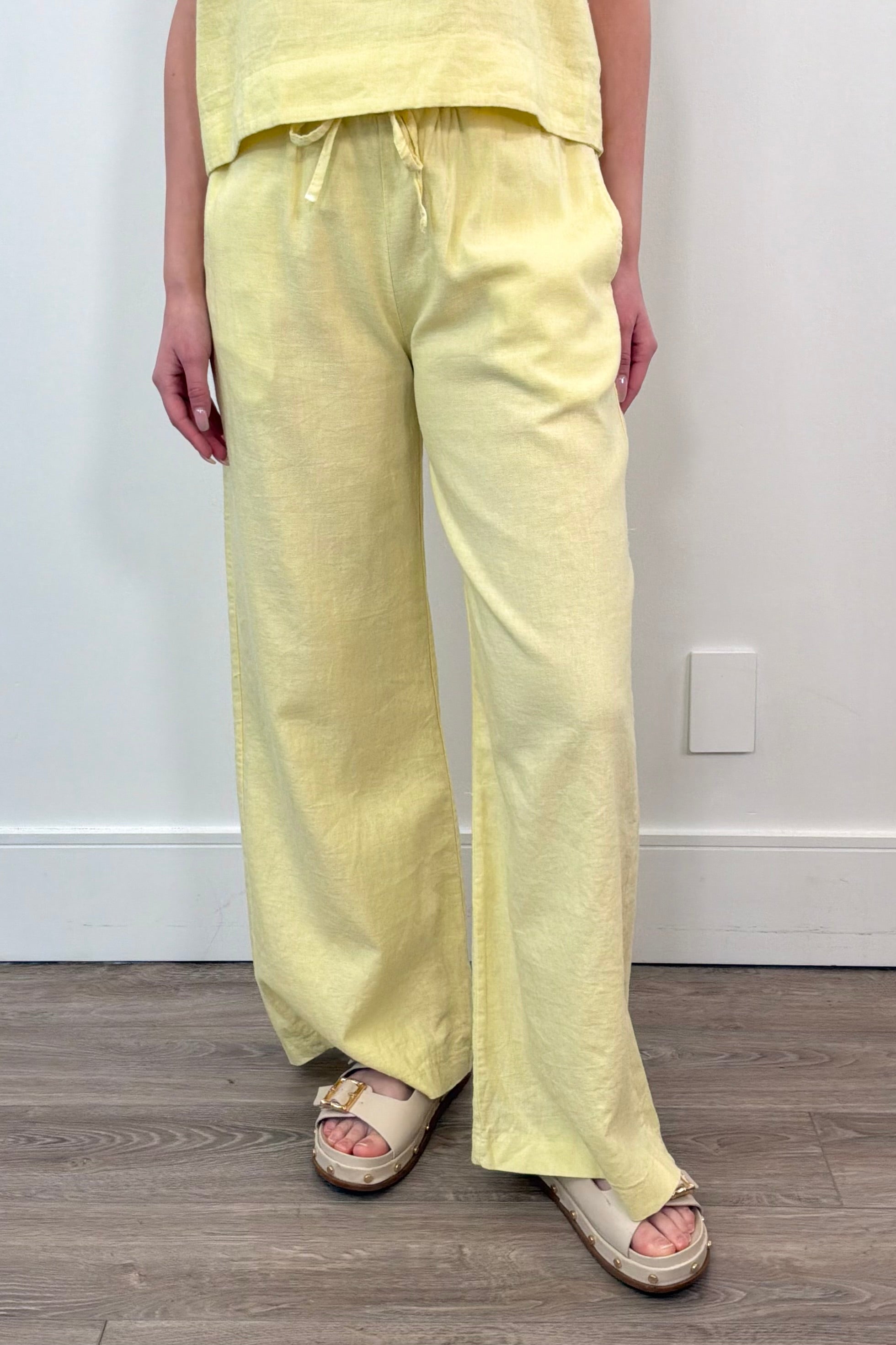 Woman wearing cotton, twill wide leg pant in light yellow