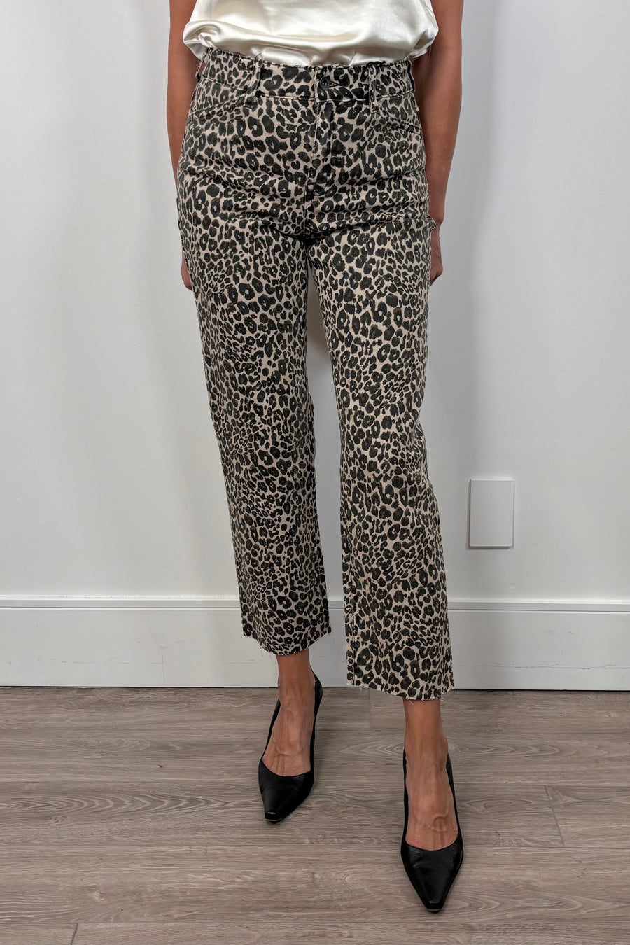 woman wearing a crop pair of leopard print jeans