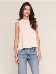 Woman wearing a cream tank top 