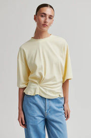 Butter yellow top with twist detail and wide sleeves