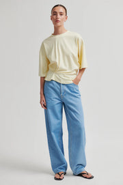 Butter yellow top with twist detail and wide sleeves