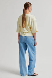 Butter yellow top with twist detail and wide sleeves