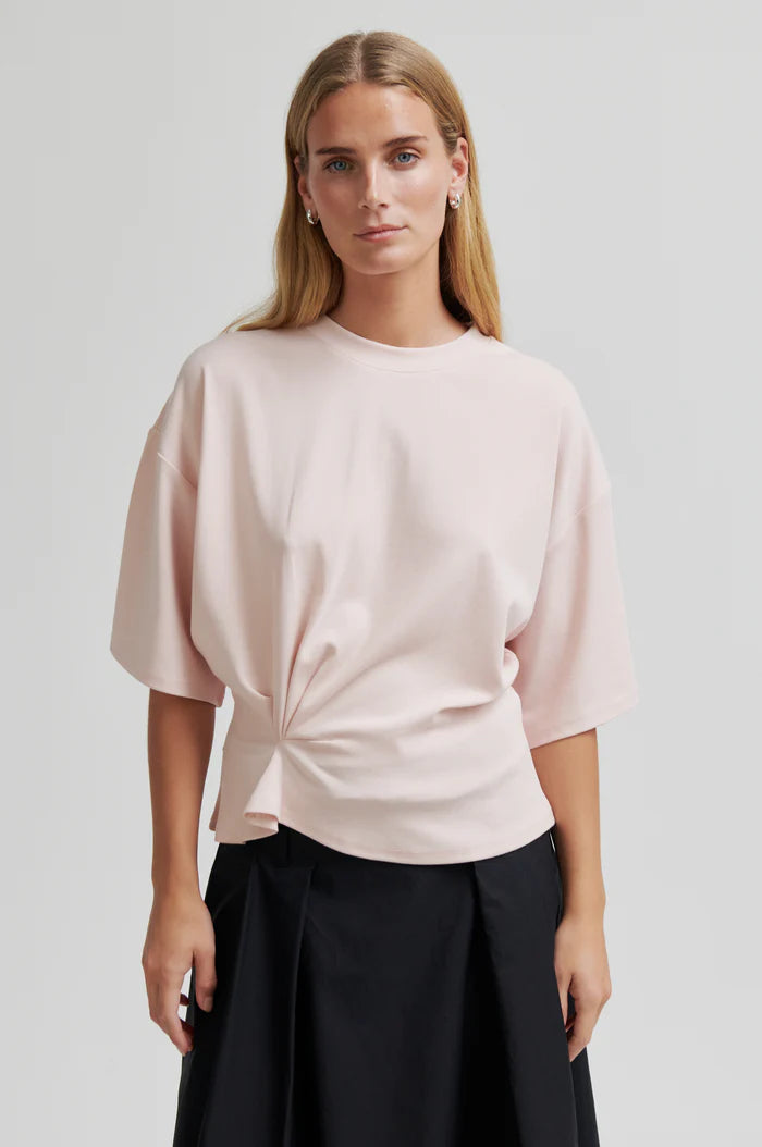 Light pink tee with twist detail and wide sleeves