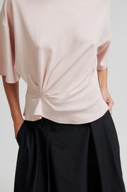 Light pink tee with twist detail and wide sleeves