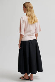 Light pink tee with twist detail and wide sleeves