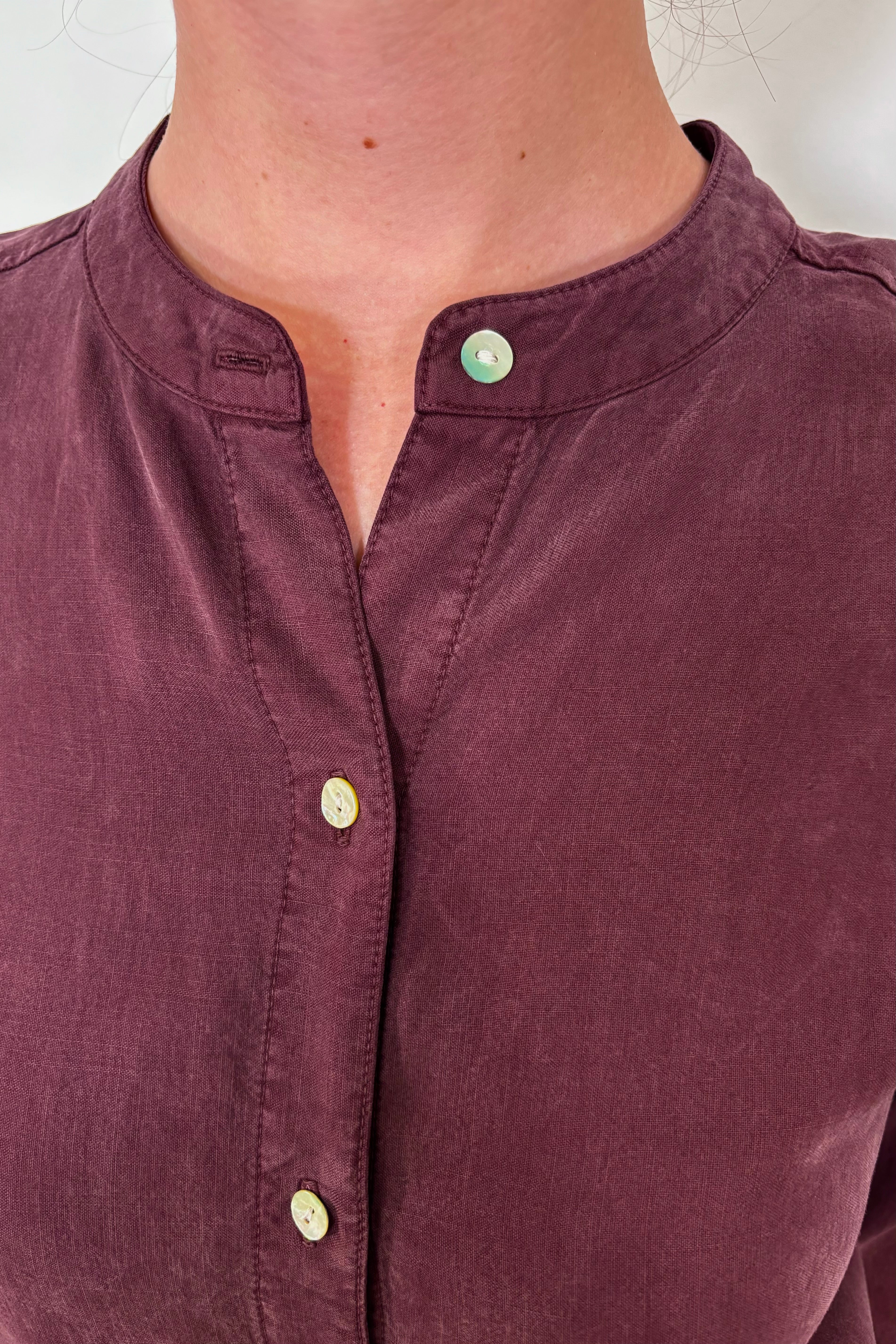 Close-up of the collar of a a maxi long sleeve button down shirt dress
