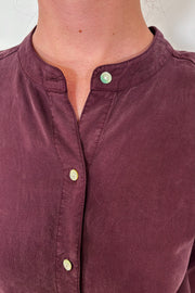 Close-up of the collar of a a maxi long sleeve button down shirt dress