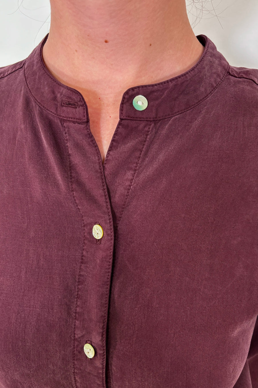 Close-up of the collar of a a maxi long sleeve button down shirt dress