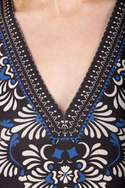 Close-up of a patterned garment with a deep V-neckline